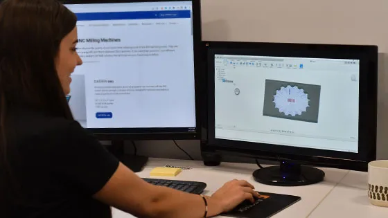 girl on computer learning what cnc programming is